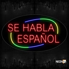 A sign bearing the Spanish phrase “Se habla español.”