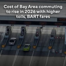 Cars passing through a highway toll booth