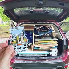 Suitcases and bags fitted together inside a car trunk