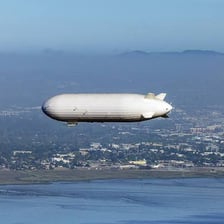 A blimp flying in the sky