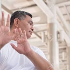 A person making a gesture of emphatic refusal