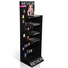 Revlon cosmetics products arranged on display.