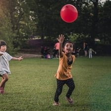 Children participating in outdoor activities at a summer day camp.