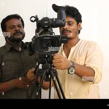 A film crew recording a movie scene with a camera