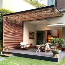 An outdoor terrace with a barbecue grill.