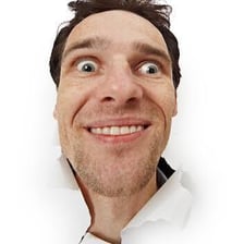 A person looking directly ahead with an intense stare.