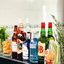 A bar displaying assorted alcoholic beverages
