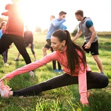 A physically fit person exercising outdoors