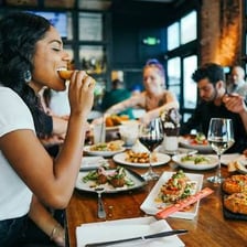 A diner eating a meal at a restaurant