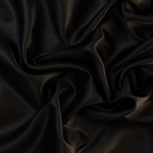 A close-up of smooth, lustrous sateen fabric