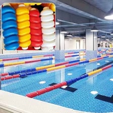 A swimming pool divided into lanes by floating lane lines