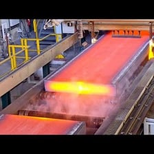 Iron-bearing material alongside finished steel