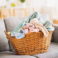 A laundry hamper containing clothes