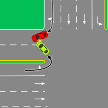 A car turning around in the middle of a roadway