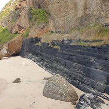 A visible mineral-rich seam running through rock