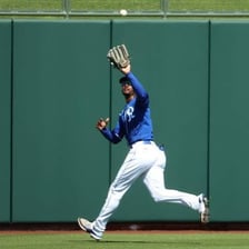 A baseball outfielder failing to catch a fly ball.