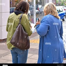 A person records responses to a public opinion poll.