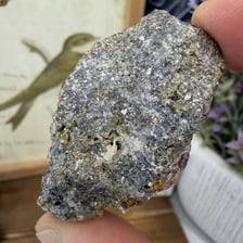 A rock specimen containing visible mineral ore.