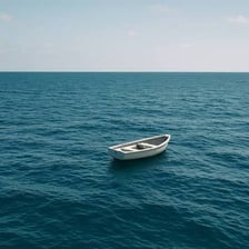 A small boat floating without a visible destination