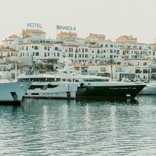 Yachts moored at docks in a marina