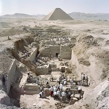 An archaeological site marked by an excavation area