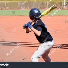 A baseball batter standing at the plate during an at-bat.