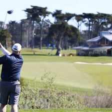 Professional and amateur golfers competing in a tournament