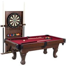 A pool cue resting beside a billiards table