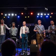 A musician giving an additional performance onstage.