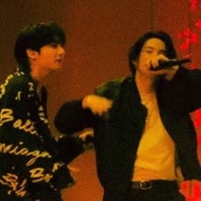 BTS members performing onstage.