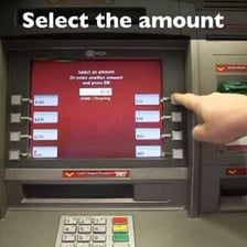 A person withdrawing cash from an ATM