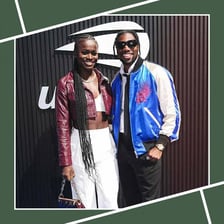 A couple posing together at a public event.