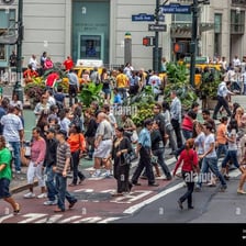 A busy crowd of people moving through a public space