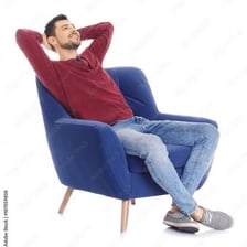 A person relaxing in a comfortable chair