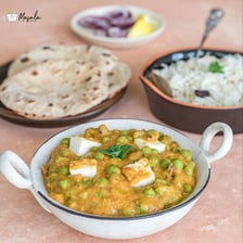 Matar paneer containing green peas and paneer cheese