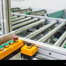 An industrial machine stopped on a factory floor.