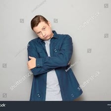 A person showing a bored, unimpressed reaction.
