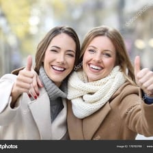Two close friends posing together.