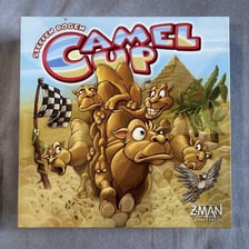 The box for the Camel Up board game showing its camel-racing theme