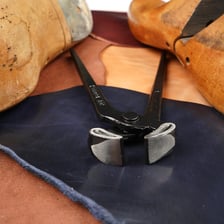 A coarse rasp used to shape leather footwear