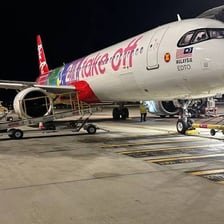 An AirAsia passenger airplane in the airline’s red livery.