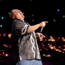 Comedian Gabriel Iglesias performing onstage.
