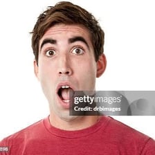 A person visibly inhaling in surprise