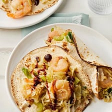 A serving of moo shu shrimp with vegetables.