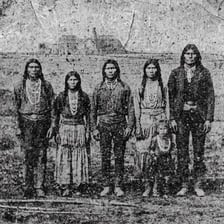 A historical photograph depicting members of the Ute people.