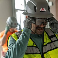 A workplace safety inspector wearing protective equipment
