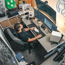 A technology enthusiast working at computer monitors