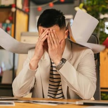 A person correcting an error on a document