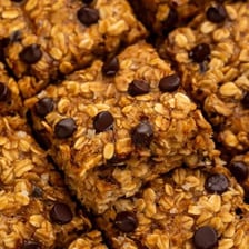 A close-up view of oats embedded in a granola bar.