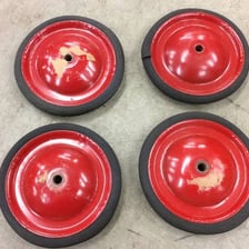The axle and wheels of a Soap Box Derby car